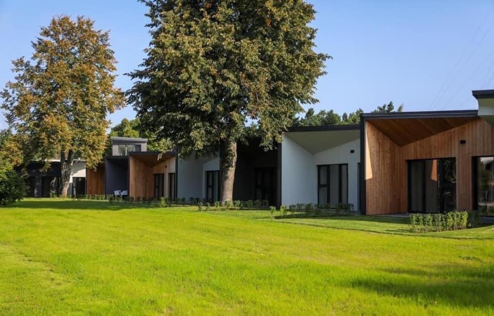 Seaside bungalow Juura at Albatross, Kesterciems with garden, Spa and pool for extra